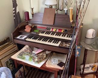 Organ, bowling tropihies, fishing rods, art