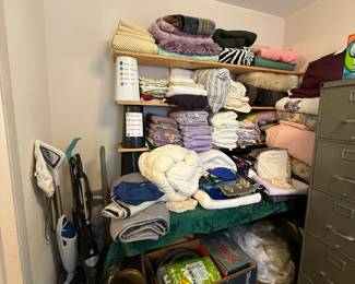 Linens, floor cleaners, file cabinet
