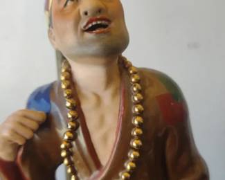vintage table lamp featuring a figurine base, likely made of porcelain or ceramic, depicting an Asia