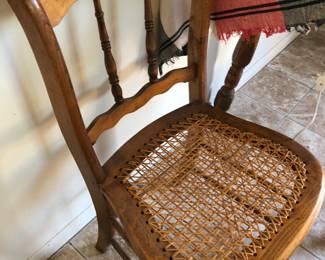 wooden chair with a cane seat