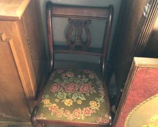 vintage Duncan Phyfe-style chair with a lyre or harp-shaped back and a floral upholstered seat