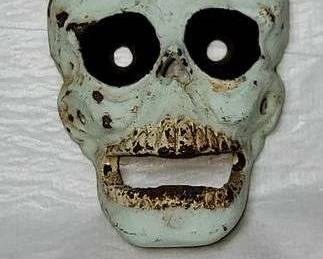 1 IRON SKULL. 3 x 4 high. Matches examples shown as BOTTLE OPENERS