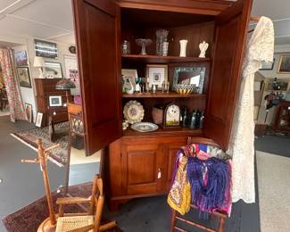 Antique corner cabinet, child's rocking chair, child's coat tree