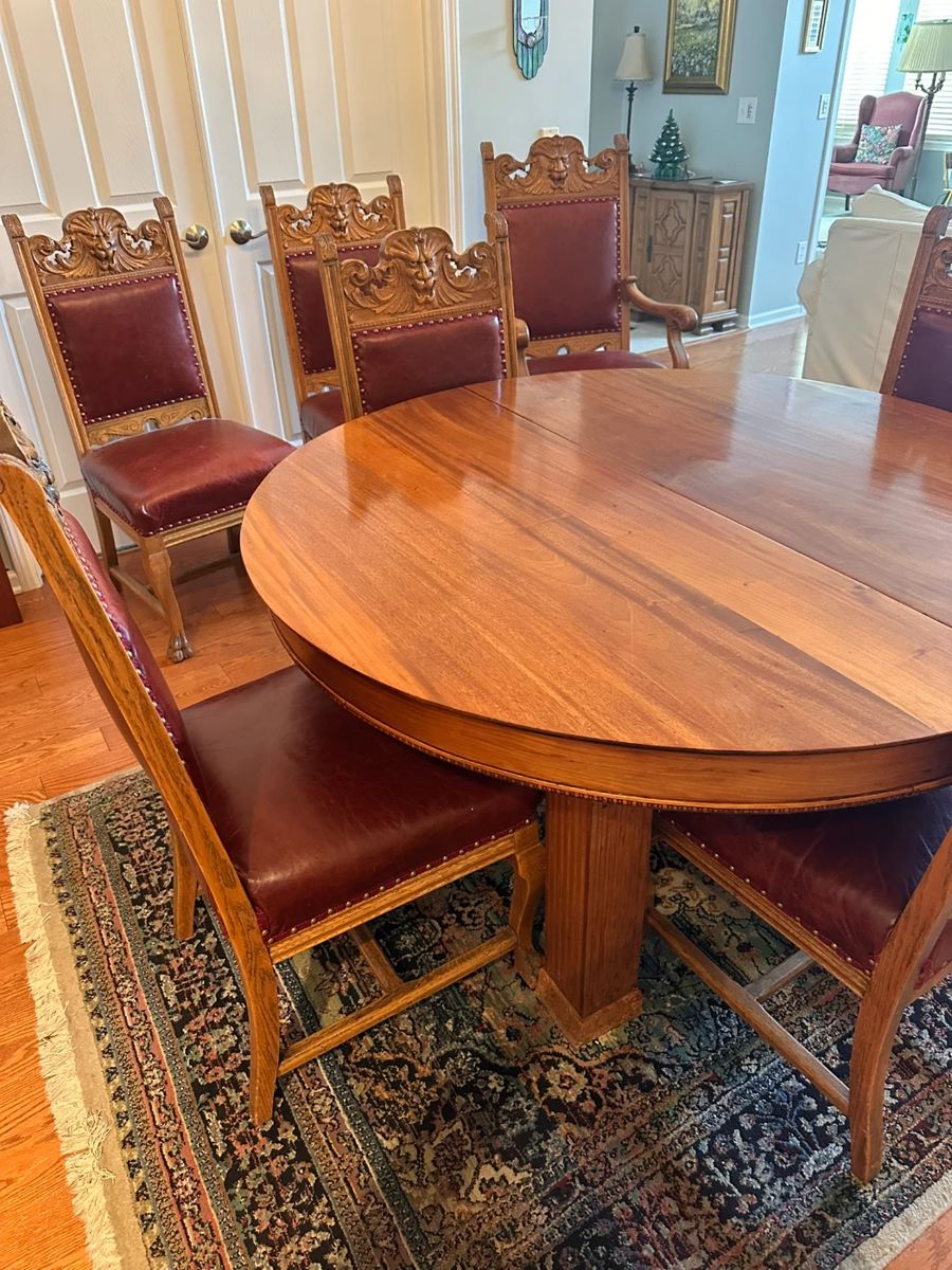Antique blonde mahogany dining table with 5 legs, 3 additional leaves. Legs have carved 3" base and 3-1/2" skirt has 1/2" beaded decoration. Circa 1890. 
Dimensions 54"d 29"h , leaves 12"d.  