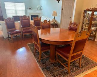 Antique blonde mahogany dining table with 5 legs, 3 additional leaves. Legs have carved 3" base and 3-1/2" skirt has 1/2" beaded decoration. Circa 1890. 
Dimensions 54"d 29"h , leaves 12"d.  