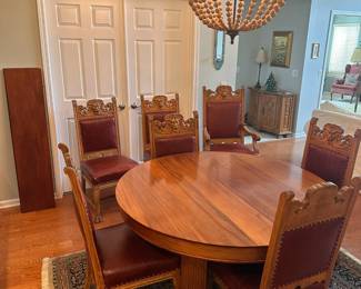 Antique blonde mahogany dining table with 5 legs, 3 additional leaves. Legs have carved 3" base and 3-1/2" skirt has 1/2" beaded decoration. Circa 1890. 
Dimensions 54"d 29"h , leaves 12"d.  
