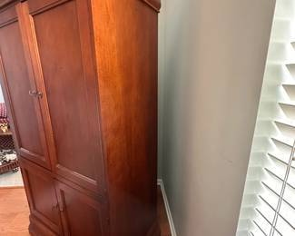 Solid wood armoire / entertainment armoire.  42"w 23"d 76"h.  2 shelves in the bottom.