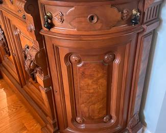Walnut, white marble top, Victorian sideboard; approx. 71" wide by 21" deep by 41" high. Two center drawers over two doors swing side drawers over side doors. Carved and applied fruit and leaves on side pillars; also carved and applied game cocks on burled center panels of front doors. All drawers and doors have the Victorian tear-drop pulls. The marble top has two drilled holes in it each side that most likely held a shelf or mirrored back. C-1865. This piece was purchased from the Wadsworth Estate in Geneseo, NY. 