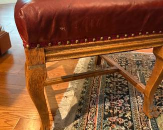 A set of six high-back oak dining room chairs plus one matching arm chair.  7 chairs total   
Chairs have a "Northwind Face" or Lion Face in center, leaf ears, claw feet, upholstered back and seat. Side chairs approx. 42 ½" high; arm chair approx. 45" high. 