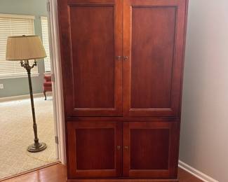 Solid wood armoire / entertainment armoire.  42"w 23"d 76"h.  2 shelves in the bottom.