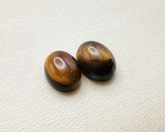 Oval cut tiger's eye cabochon gemstones