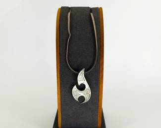 Sterling silver chain with a silver tone native style flame pendant