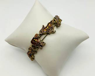 leopard enamel and gold tone charm bracelet