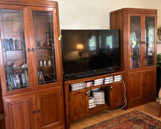 Stickley 21st century wall cabinet entertainment unit.  Panasonic TV and Yamaha soundbar.