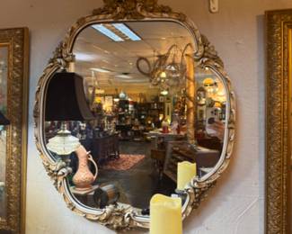 Italian Rococo-stye gilt wood mirror with an ornate carved frame 
