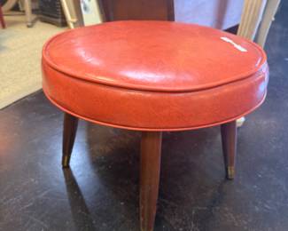 Vintage MCM orange vinyl footstool with wooden tapered legs 