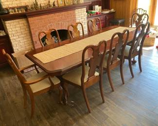 Another view of this awesome dining room table and eight chairs.