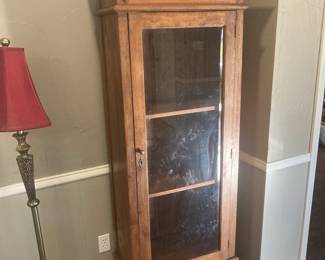 Walnut Cabinet with three shelves and a drawer at the bottom.