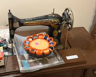 1925 Antique sewing machine. Sews beautifully, treddle foot.