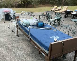 Hospital bed with pressure relief mattress, walkers, outside patio items, yard tools