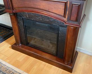 Electric Fireplace - Heater with a wooden Mantel