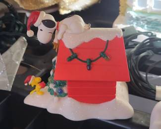 Hallmark's Peanuts Snoopy on holiday Doghouse Christmas Ornament