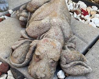 Concrete garden statue of a dog