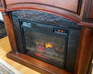 Electric Fireplace - Heater with a wooden Mantel