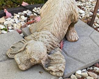 Concrete garden statue of a dog