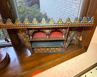 Hand-Painted Moroccan Wall Shelf
Vibrant hand-painted wooden wall shelf featuring intricate geometric and floral motifs in bold reds, blues, and golds. Crafted in traditional Moroccan or Moorish style, perfect for displaying small decor or adding global flair to any room.