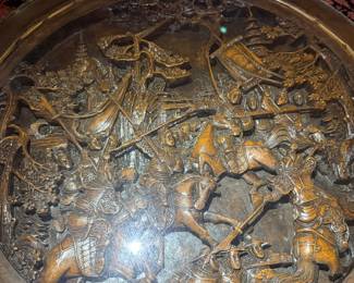 Carved Asian Coffee Table with Nesting Stools
Intricately carved round wood table featuring detailed relief artwork and four matching nesting stools. Beautiful craftsmanship and functional design.