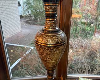 Large brass and copper etched floor vase with intricate floral and geometric designs.