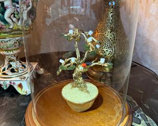 Got it — here’s the EstateSales.net description for this item in your ready-to-paste format:
⸻
Gemstone Tree Under Glass Dome
Delicate handcrafted gemstone bonsai tree with colorful polished stone leaves and gold wire branches under a clear glass dome on a wooden base. Elegant mid-century decorative piece symbolizing good fortune and balance.