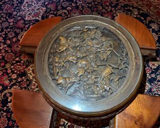 Carved Asian Coffee Table with Nesting Stools
Intricately carved round wood table featuring detailed relief artwork and four matching nesting stools. Beautiful craftsmanship and functional design.