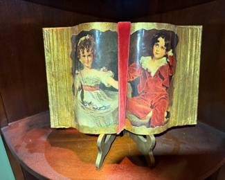 Vintage Porcelain Book with Victorian Portraits
Charming decorative porcelain “open book” featuring hand-painted Victorian-style ladies. Unique collectible accent piece in excellent condition.