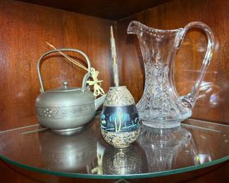 Crystal Pitcher, Pewter Teapot & Hand-Painted Vase Trio
Elegant display set featuring a cut crystal pitcher, ornate pewter teapot, and decorative hand-painted vase. Beautiful mix of textures and craftsmanship.