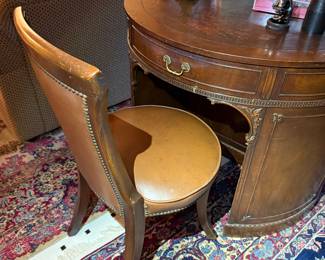 Vintage mahogany kidney desk with leather-top chair.
