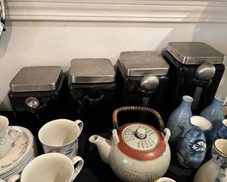 Cascading set of black canisters