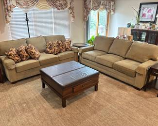 Matching sofas leather coffee table with drawer and section that raises to be a table