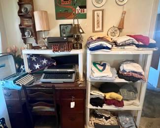 Desk, typewriters, clothes