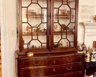 Matched vintage pair of lighted Chippendale style cabinets by Mount Airy Furniture Corp...
