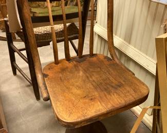 antique schoolhouse swivel chair on cast iron base