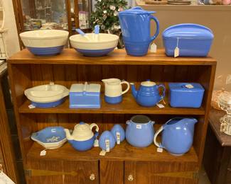 blue and white ware in pine cabinet
