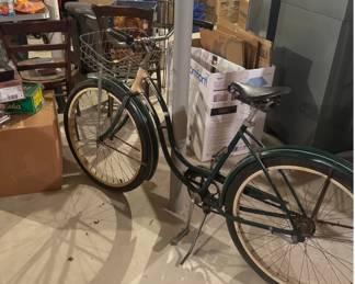 Vintage Schwinn Spitfire Bicycle – Classic Green
Cruise in timeless style with this vintage Schwinn Spitfire, made in Chicago, IL. This beautiful classic features Schwinn’s signature sturdy steel frame in a deep forest-green finish with cream accents and the original decals intact.
Features:
Iconic Schwinn Spitfire badge and headplate
Front wire basket — perfect for errands or display
Step-through frame for easy riding
Original chrome handlebars and fenders
Coaster brake and wide comfort saddle
This bike has been stored indoors and shows normal wear for its age, including some cosmetic scuffs and patina on metal parts, adding to its authentic vintage charm.
Perfect for restoration, display, or leisurely neighborhood rides.