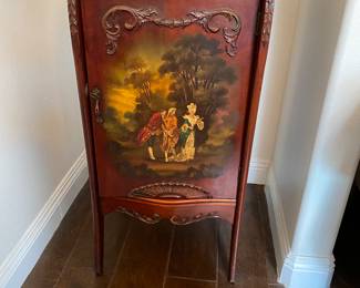 Beautiful painting on an antique. Shelves on the inside that fits books.