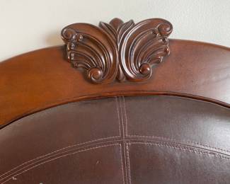 Headboard of bed frame. Wood in excellent condition. Vegan leather has peeled off and needs to be reupholstered.