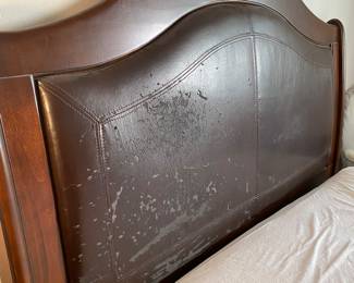 Headboard of bed frame. Wood in excellent condition. Vegan leather has peeled off and needs to be reupholstered. Can easily be replaced with fabric so it never happens again