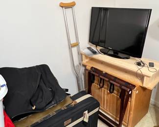 TV on stand, luggage, shoes