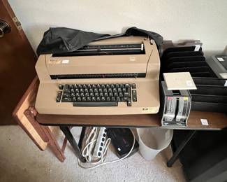 Electric typewriter, scale, shredder, tray table