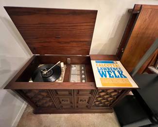 Zenith stereo console with record player. Everything works. Good sound on records and FM radio